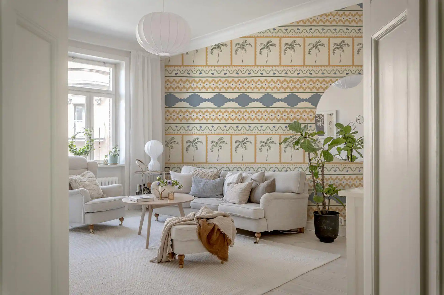 Tonal Marrakesh ornament wallpaper enclosing a quiet lounge corner with cream and sage., GD9665