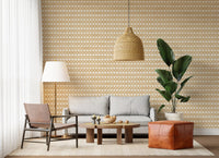 Stamped cross rows of sand zellige wallpaper covering another living room angle.