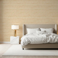 Honey-cream surface of zellige cross ornament wallpaper, sand marks on linen weave.