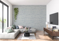 Calm rows of cross tiles in slate blue zellige wallpaper backing a relaxed living room., GD9669