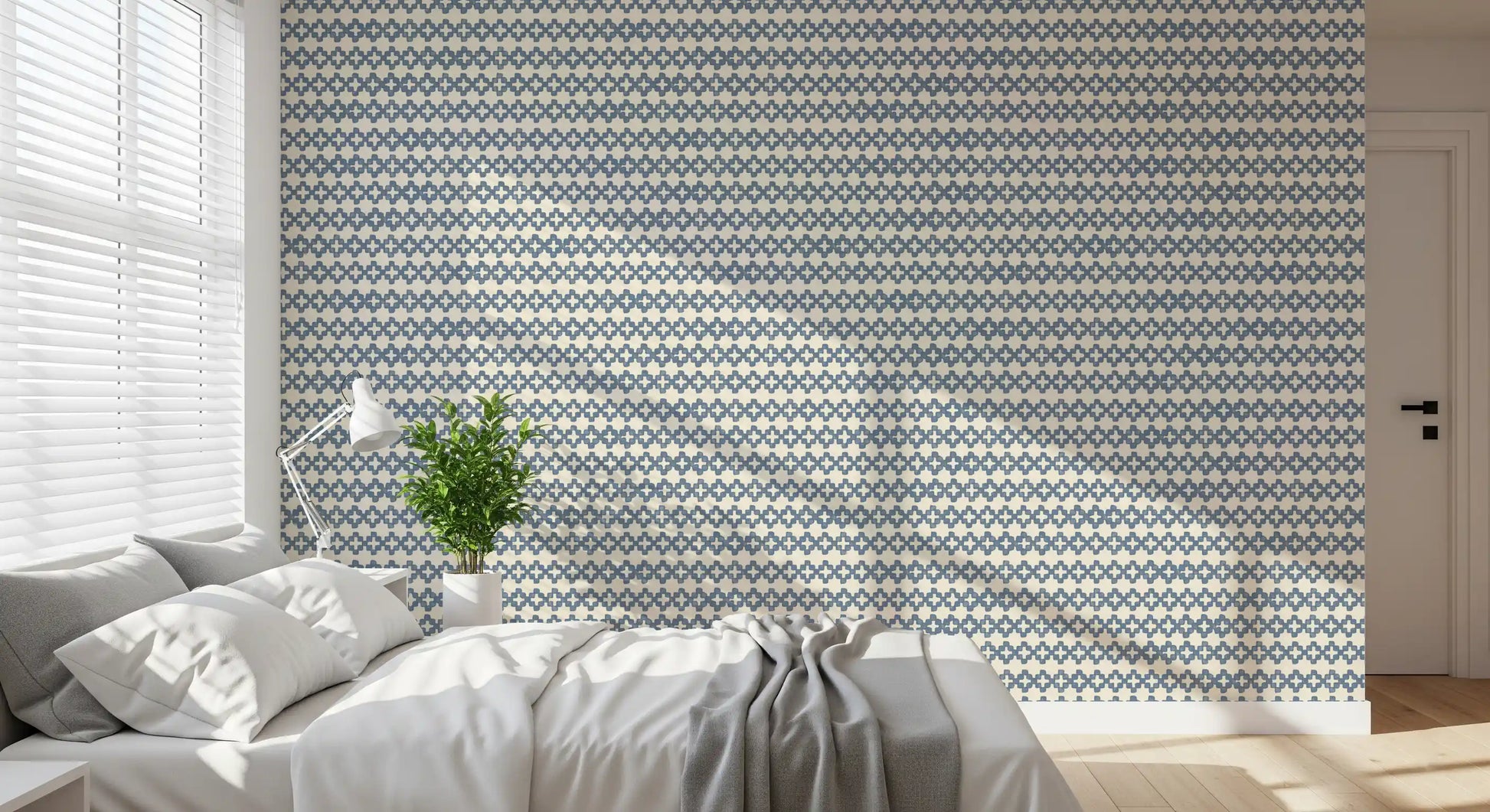 Slate blue cross motifs lined up in horizontal rows on a cream linen zellige wallpaper., GD9669