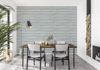 Horizontal cross repeats of slate blue zellige wallpaper landing on a dining room wall., GD9669