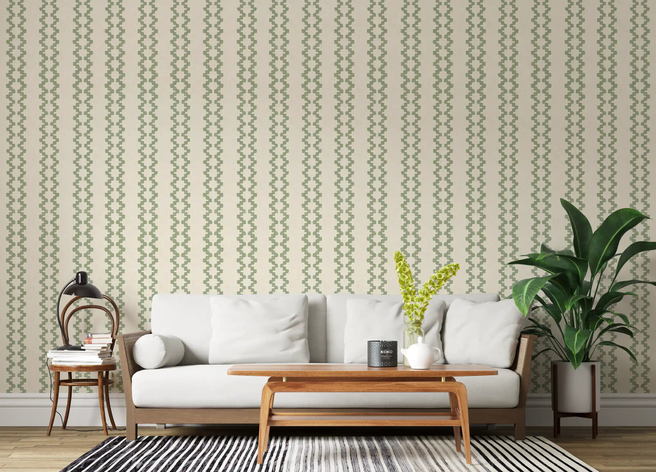 Living room shot framed by coastal green zellige stripe wallpaper as a feature.