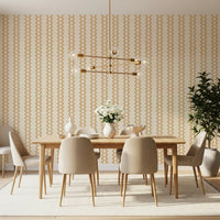 Stacked-bead motifs in honey, repeated down zellige striped wallpaper sections.