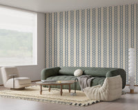 Boho stripe ornament wallpaper  framing a relaxed living room layout in slate blue.