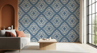 Cream marks balance a Living room beside this slate blue ornament wallpaper backdrop.
