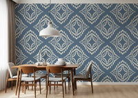 Boho diamond stamps brighten a quiet Dining room through this canvas-textured slate wallpaper.