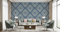 Slate blue depth grounds a Living area against this cream stamp wallpaper repeat.