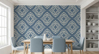Concentric cream diamonds wrap a serene Dining room in this slate blue boho wallpaper.