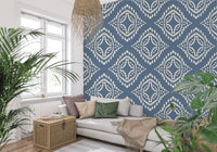 Cream dot marks build large concentric diamonds across this slate blue canvas wallpaper.