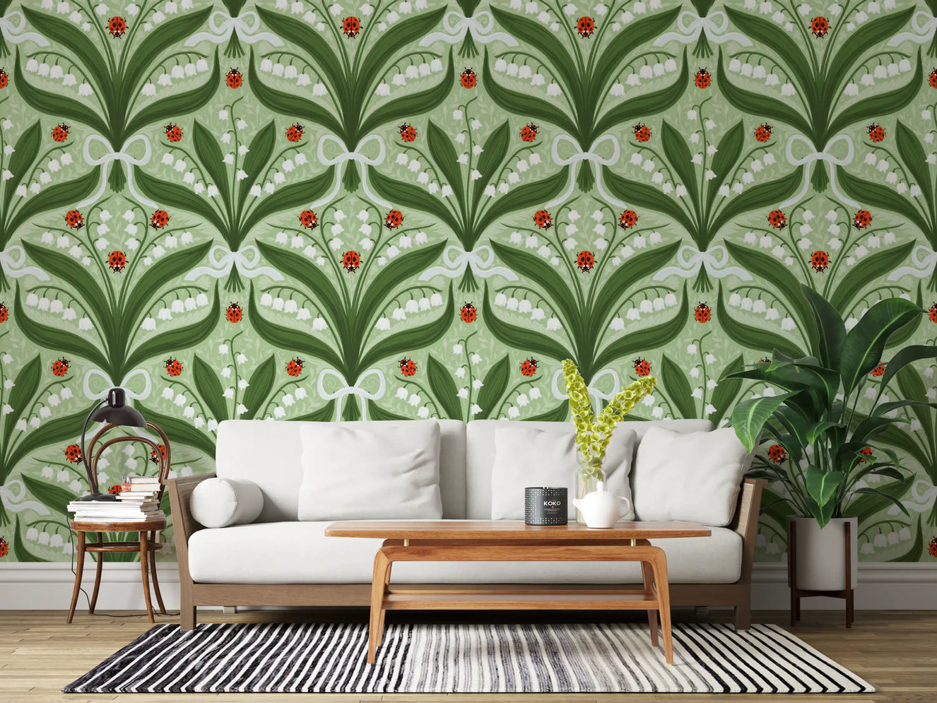 Sage green and red tones fill a living room with this lily of the valley wallpaper.