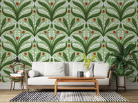 Sage green and red tones fill a living room with this lily of the valley wallpaper.