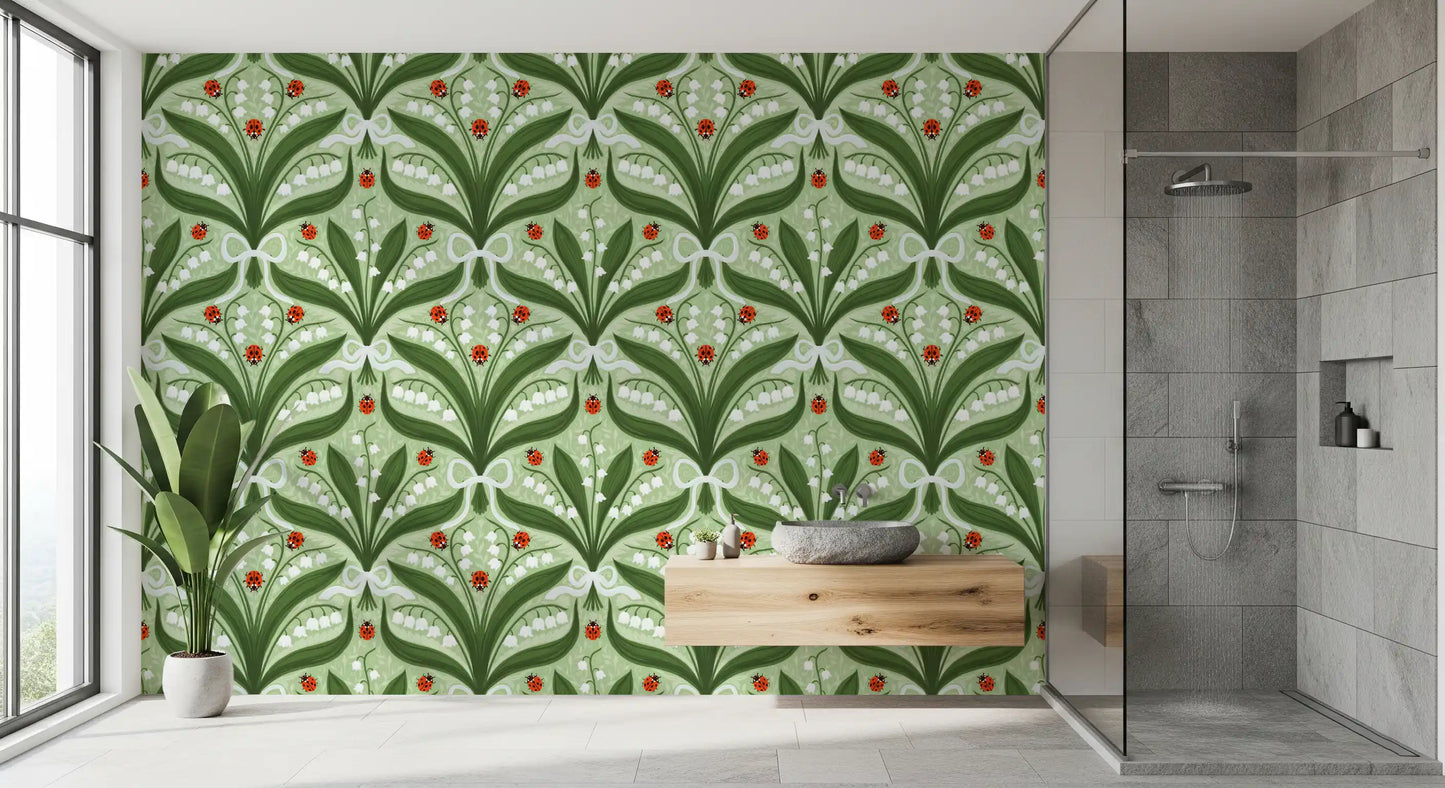 Big green leaves and red ladybugs brighten a bathroom with this botanical wallpaper.