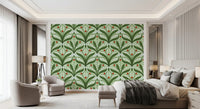 Mirrored leaf fans cradle white lily flowers across this sage green wallpaper repeat.