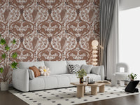 Squirrels and acorns animate a quiet lounge inside this woodland brown wallpaper.