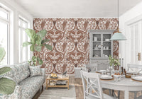 Oak leaves in tonal cream and brown fan out across this woodland wallpaper.