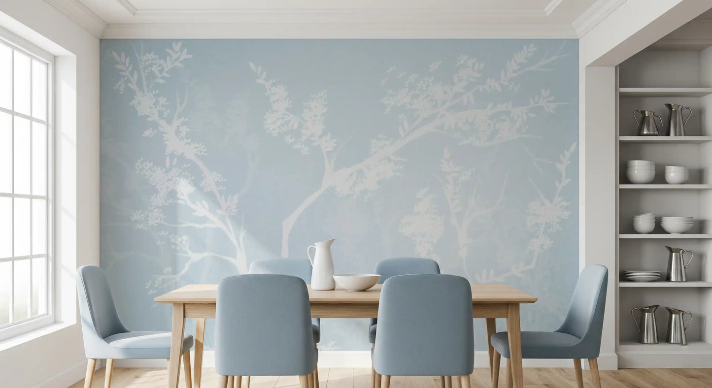 White blossom silhouette wall mural filling a dining room in pale blue