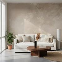 Beige botanical wall mural covering a modern living room in layered misty tones