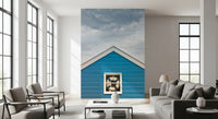 Blue Beach Hut Coastal Charm wall mural showing a peaked gable and cloudy sky