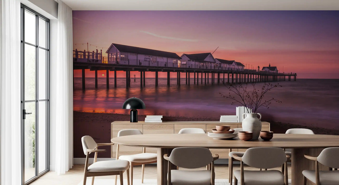 Long wooden pier at golden hour coastal sunset pier reverie wall mural