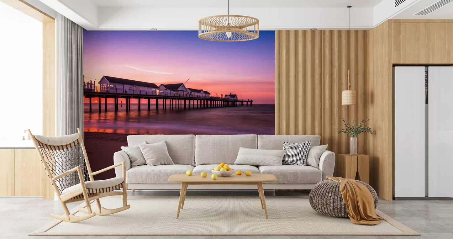 Living room with coastal sunset pier reverie wall mural dusk tones