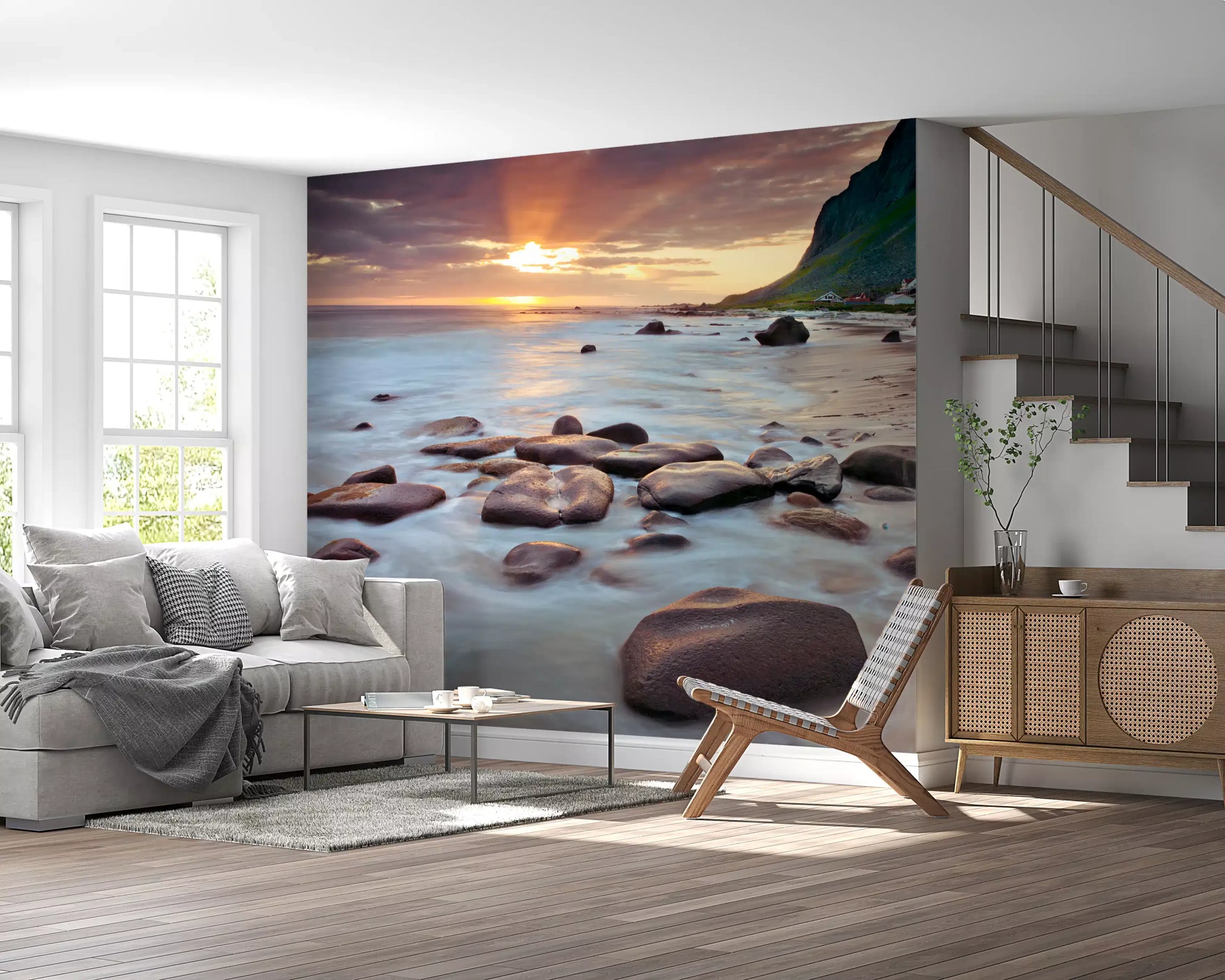 Sun rays cast over rocky shore on this coastal sunset serenity wall mural.