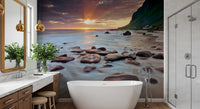 A bathroom surrenders to sunset with this coastal serenity wall mural.
