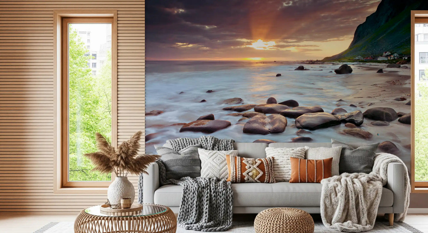 Coastal sunset serenity wall mural, golden sky over rocky beach and gentle surf.