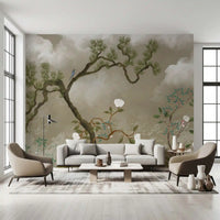 A blue bird perched on a pine branch in the chinoiserie garden wall mural.