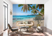 Pale sand and turquoise waves captured in the Tropical Beach Paradise wall mural