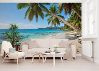 Palm tree coastline wall mural spanning a sunlit living room