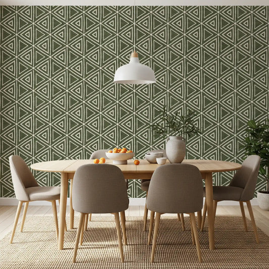 Moss green mudcloth triangle wallpaper covering a dining room in earthy sage tone