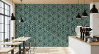 Rough-edged triangle motifs running across the boho teal mudcloth wallpaper, GD9725