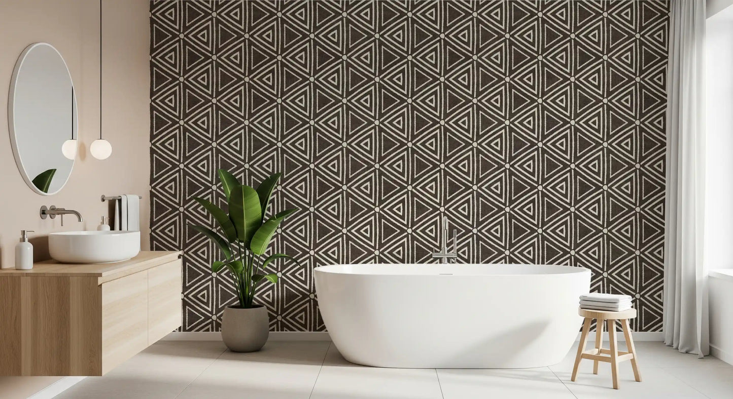 Earthy geometric mudcloth wallpaper against a bathroom in dark umber