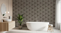 Earthy geometric mudcloth wallpaper against a bathroom in dark umber