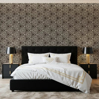 Geometric mudcloth triangle wallpaper wrapping a bedroom in dark umber brown