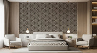 Boho triangle wallpaper across a bright bedroom with umber and cream pattern