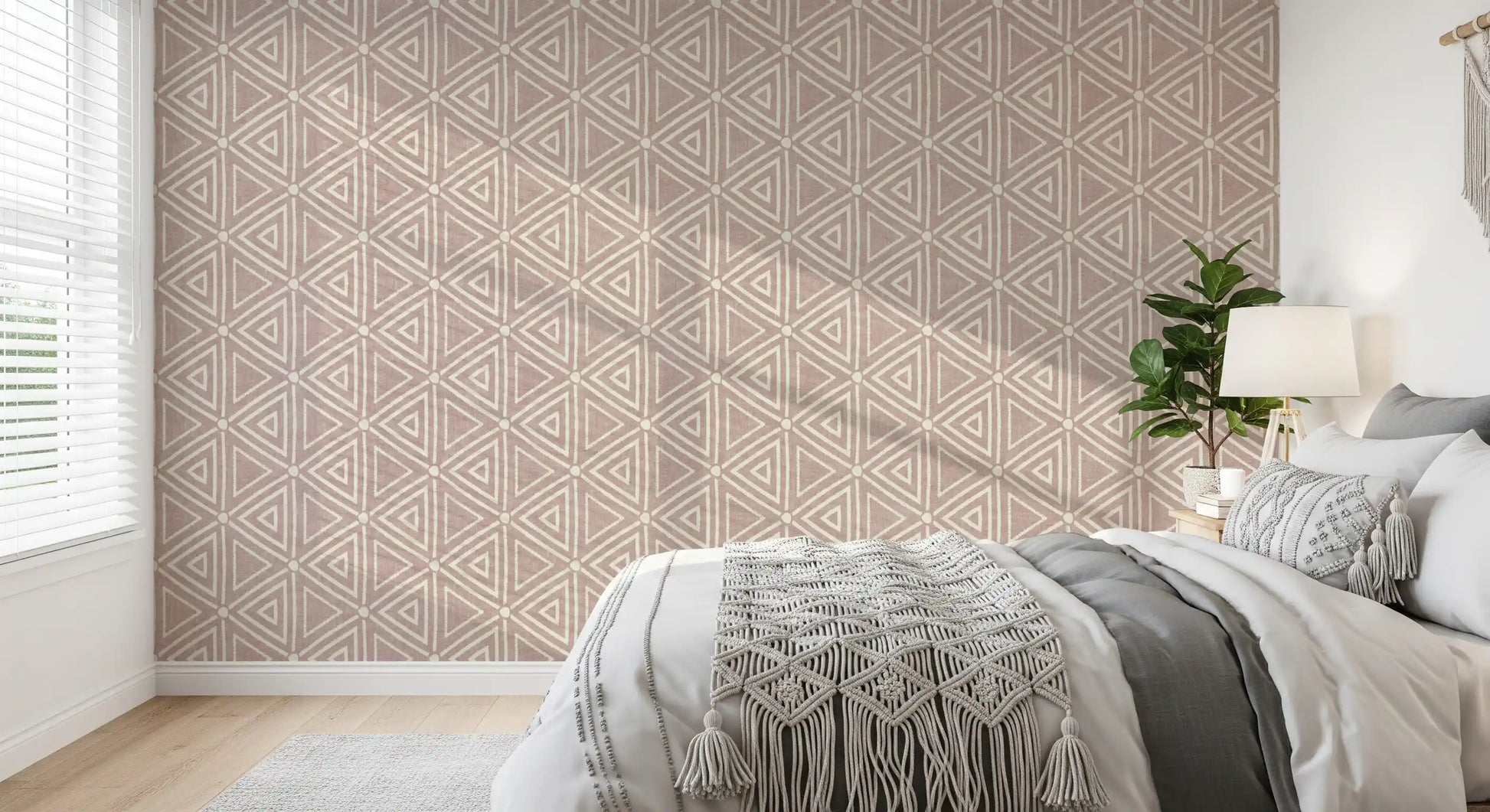 Cosy bedroom area  gain mud cloth charm from this boho triangle wallpaper.
