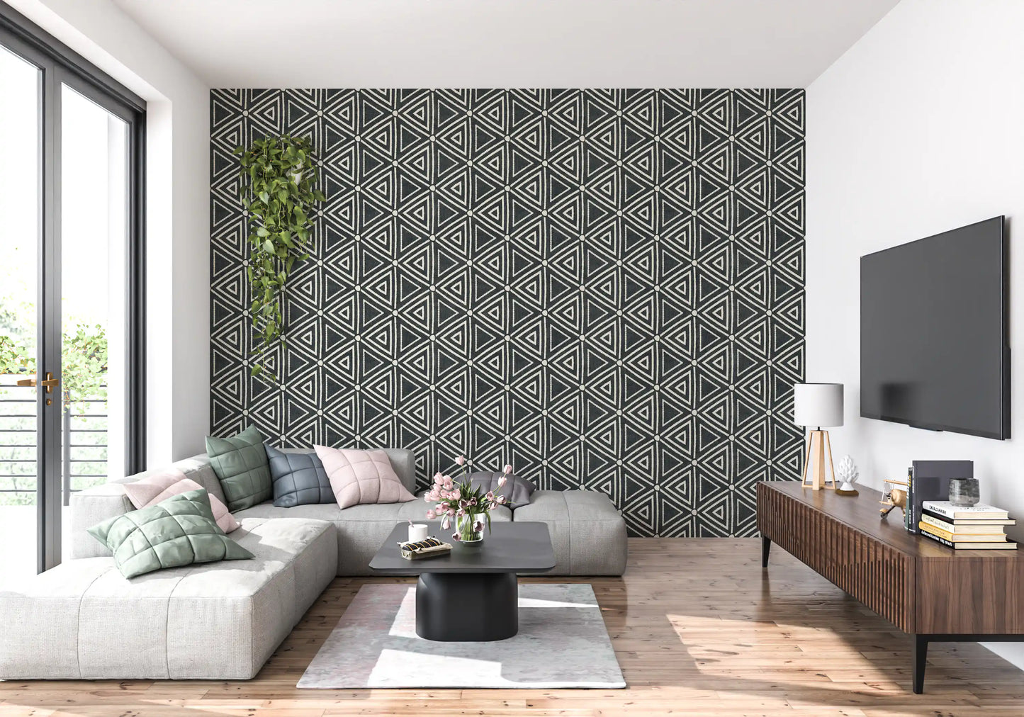 Sketched cream triangles run across a charcoal mudcloth wallpaper in a chic living room.