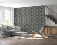 Cream triangles arranged in mirrored rows across a charcoal Mudcloth Geometric wallpaper.