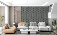 Mudcloth Triangle wallpaper styles a calm Living room area with bold geometric character.