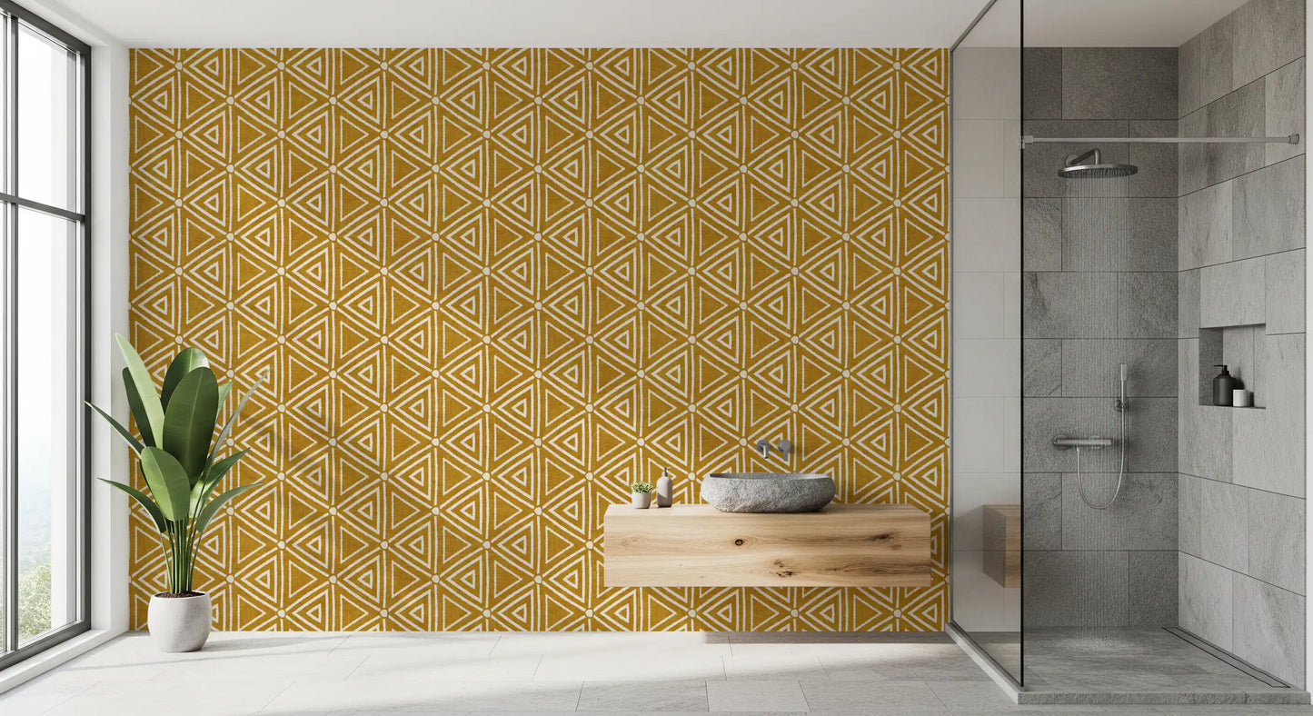 Mustard mudcloth wallpaper textured with irregular geometric triangles and dots.