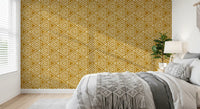 Bold white triangles repeat across this mustard yellow mudcloth wallpaper.