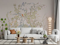 Living room calmed by the chinoiserie songbird wall mural in pink and green.