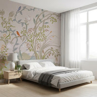 Chinoiserie wall mural giving a bedroom corner a quiet painterly feel.