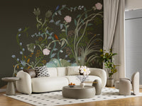 A moody chinoiserie wall mural deepens lounge spaces with painted vines and birds.