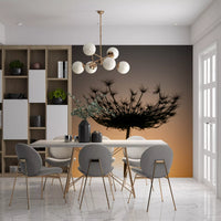 Behind the seed head, a graduated sky shifts from gray to warm gold in this wall mural.