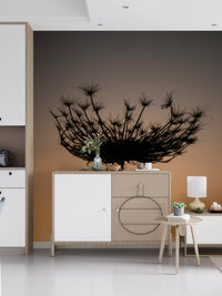 Backlit by gold, the seed head appears as crisp black outline on this wall mural.