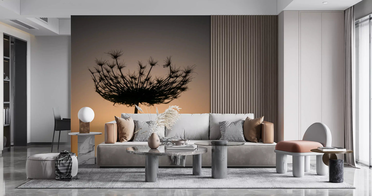 Living room warmth deepens around a golden hour silhouette wall mural with seed head.