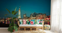 Warm Thames city glow wall mural shown on a lounge feature 